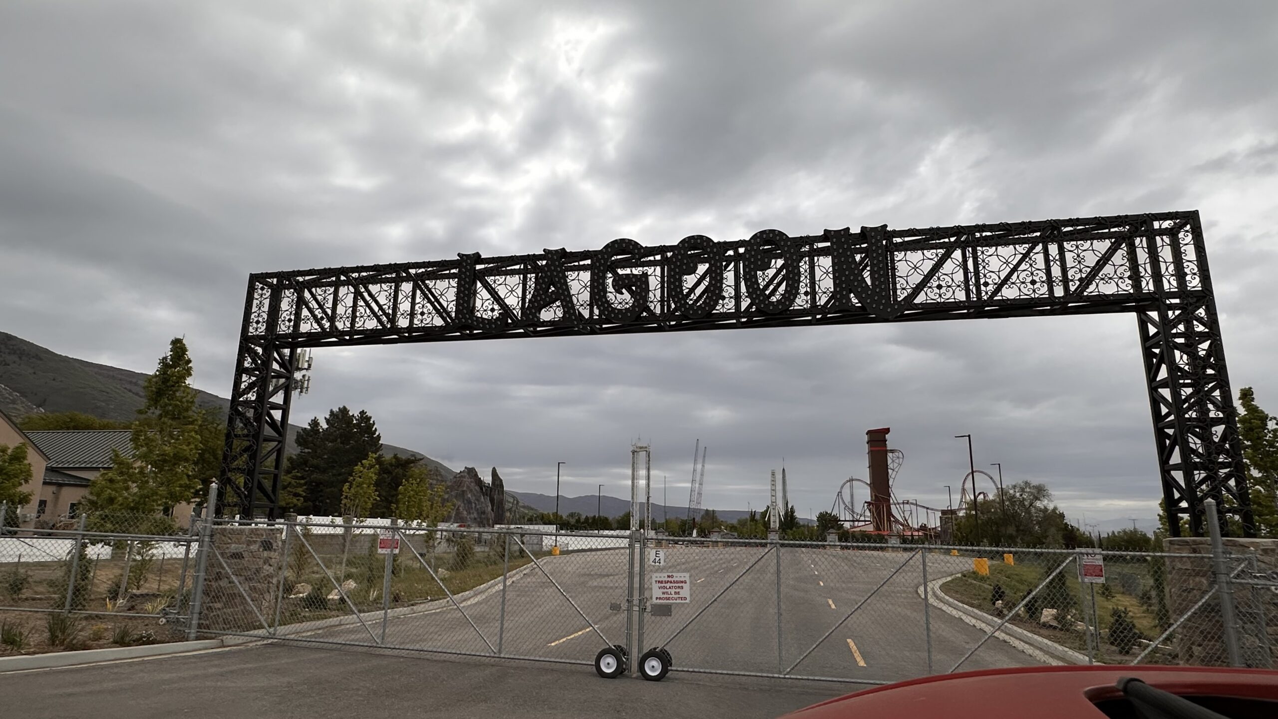 New Lagoon entrance gate in Farmington Utah with roller coasters behind